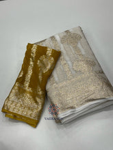 Load image into Gallery viewer, New Festive Wear White n Gold Zari Weaving Viscose Georgette Fancy Designer Saree With Blouse