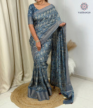 Load image into Gallery viewer, Gorgeous Party Wear Muslin Cotton Ajrakh Print Zari Jacquard Border Tussel Work Fancy Designer Saree
