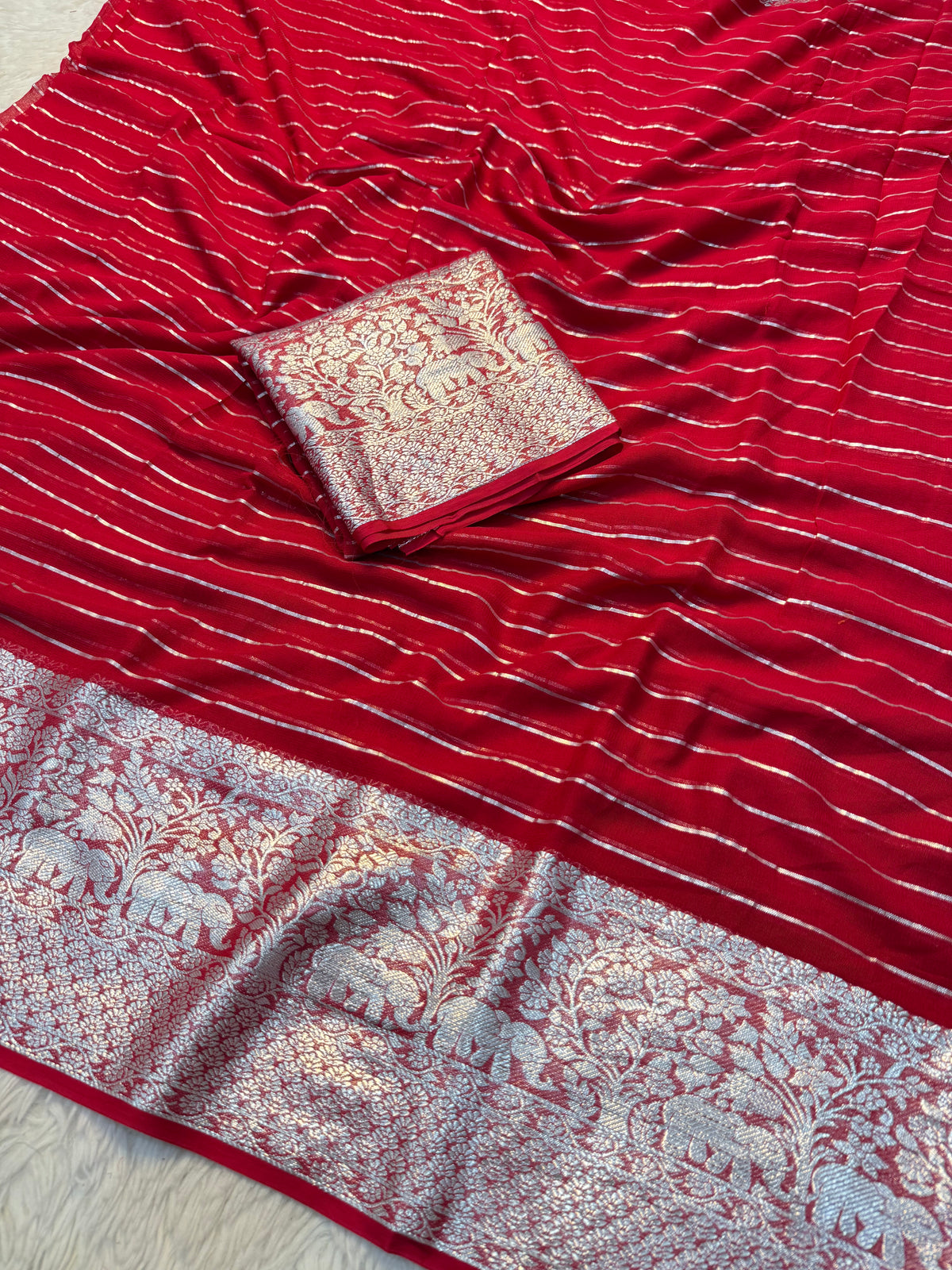 Forbearance Festive Wear Viscose Georgette Jacquard Zari Weaving Work Fancy Saree With Blouse Piece