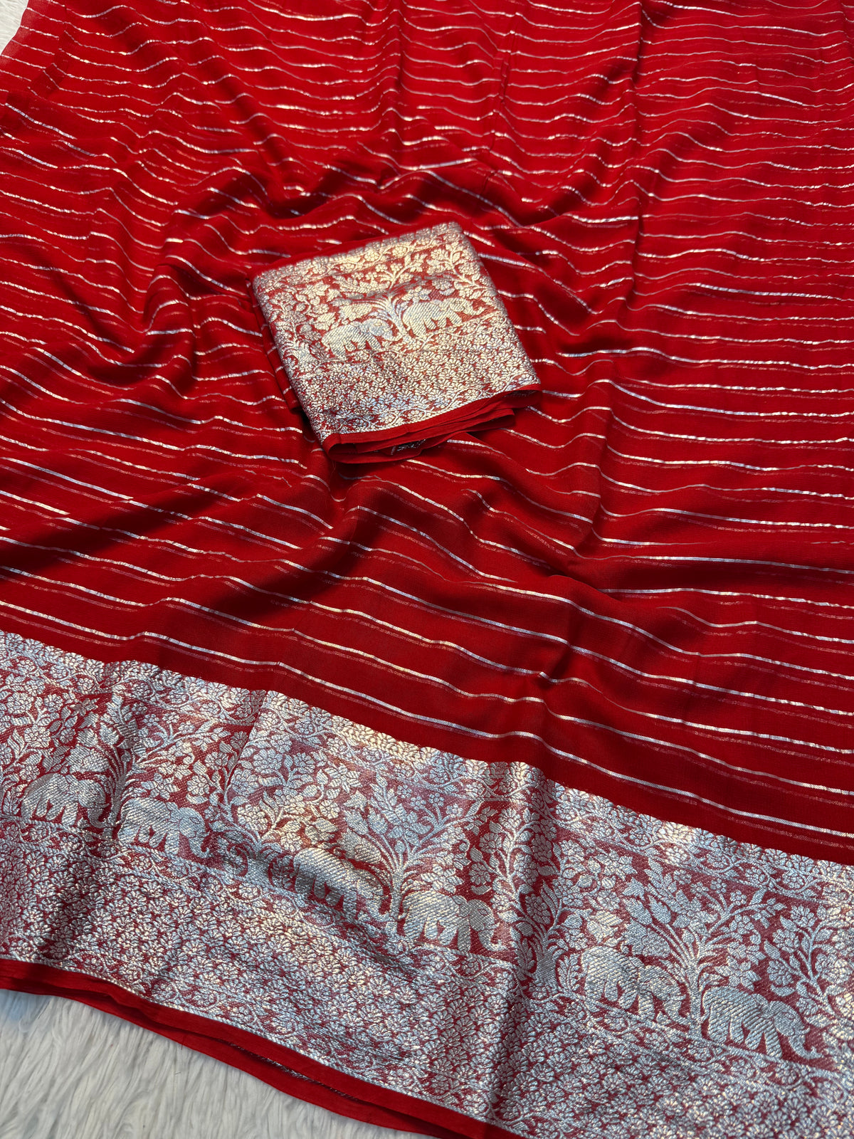 Forbearance Festive Wear Viscose Georgette Jacquard Zari Weaving Work Fancy Saree With Blouse Piece
