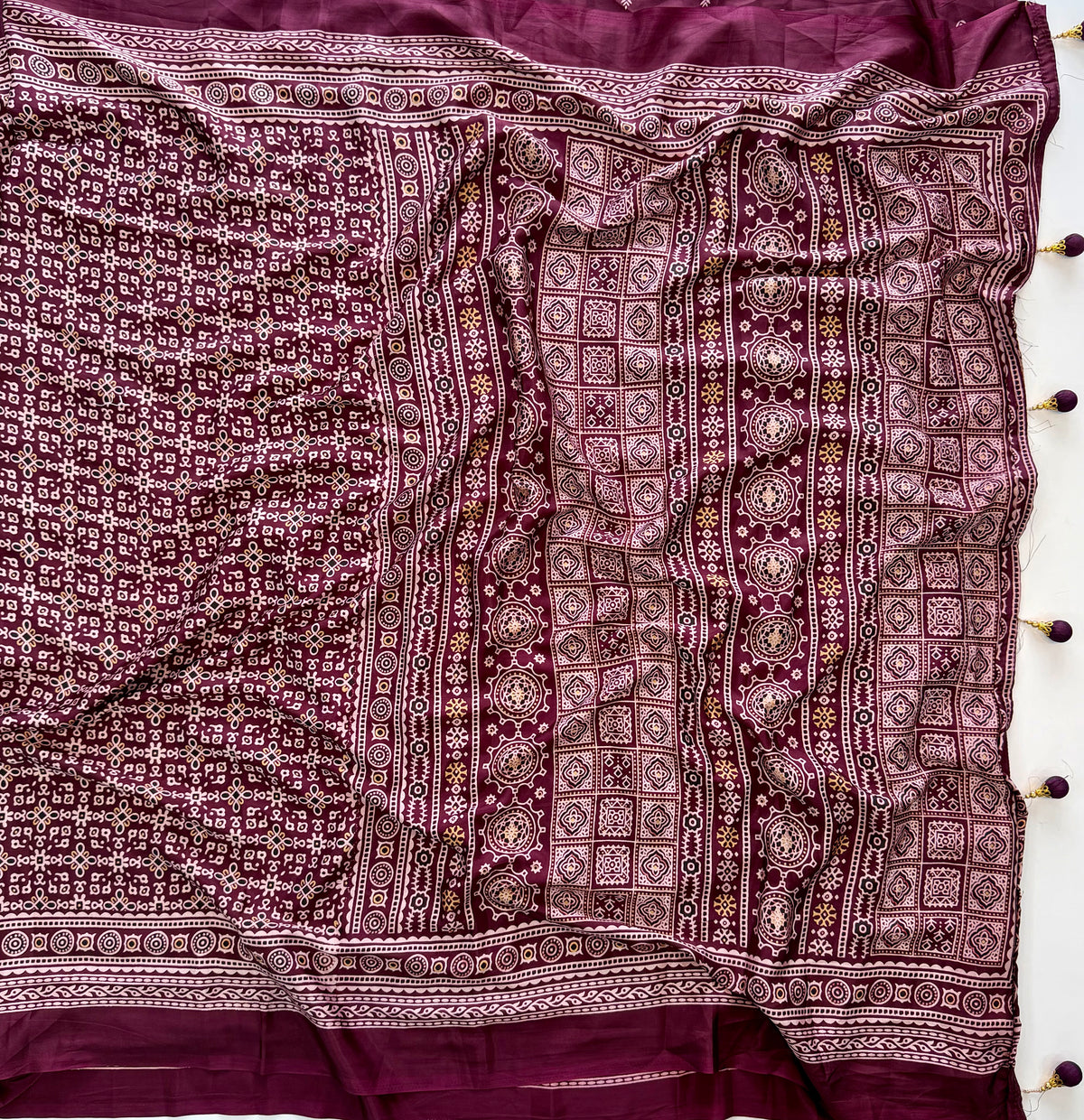 Dazzling Party Wear Crape Silk Ajrak Printed Tussel Work Fancy Saree With Blissful Blouse Piece