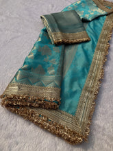 Load image into Gallery viewer, Delightful Wedding Wear Sky Blue Color Soft Banarasi Silk Jacquard Zari Weaving With Lace Border Work Fancy Designer Saree
