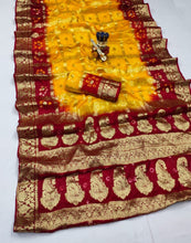 Load image into Gallery viewer, Latest Wedding Wear Hand Bandhej Silk Saree With Zari Weaving Work
