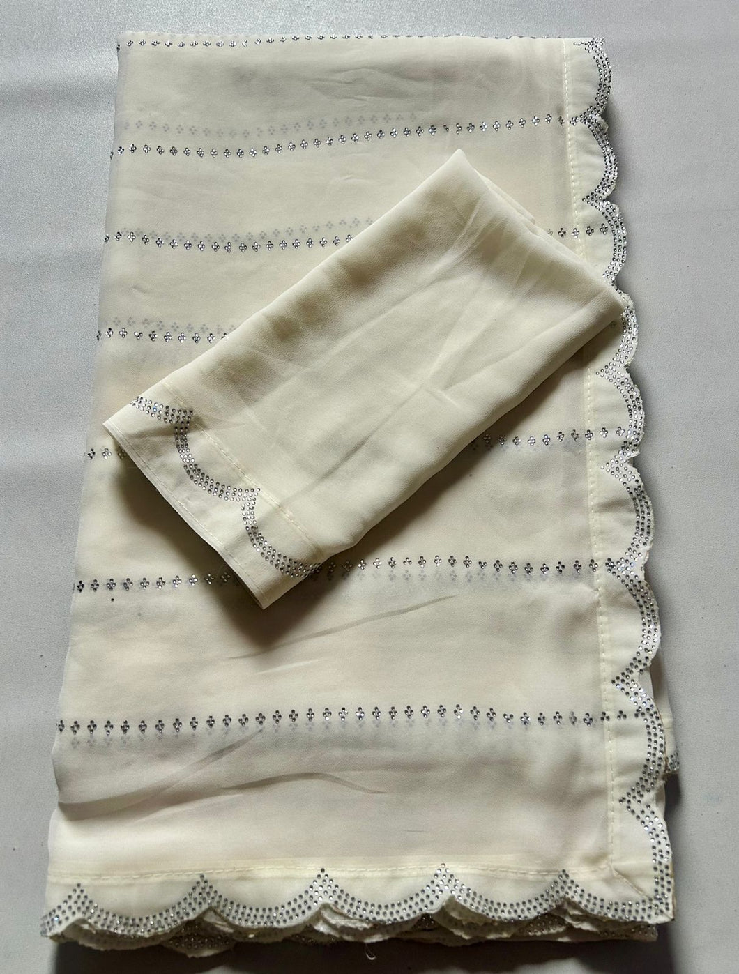 Dalliance Off White Color Soft Georgette Heavy Jarkan Stone Work Fancy Designer Partywear Saree With Sonorous Blouse Piece