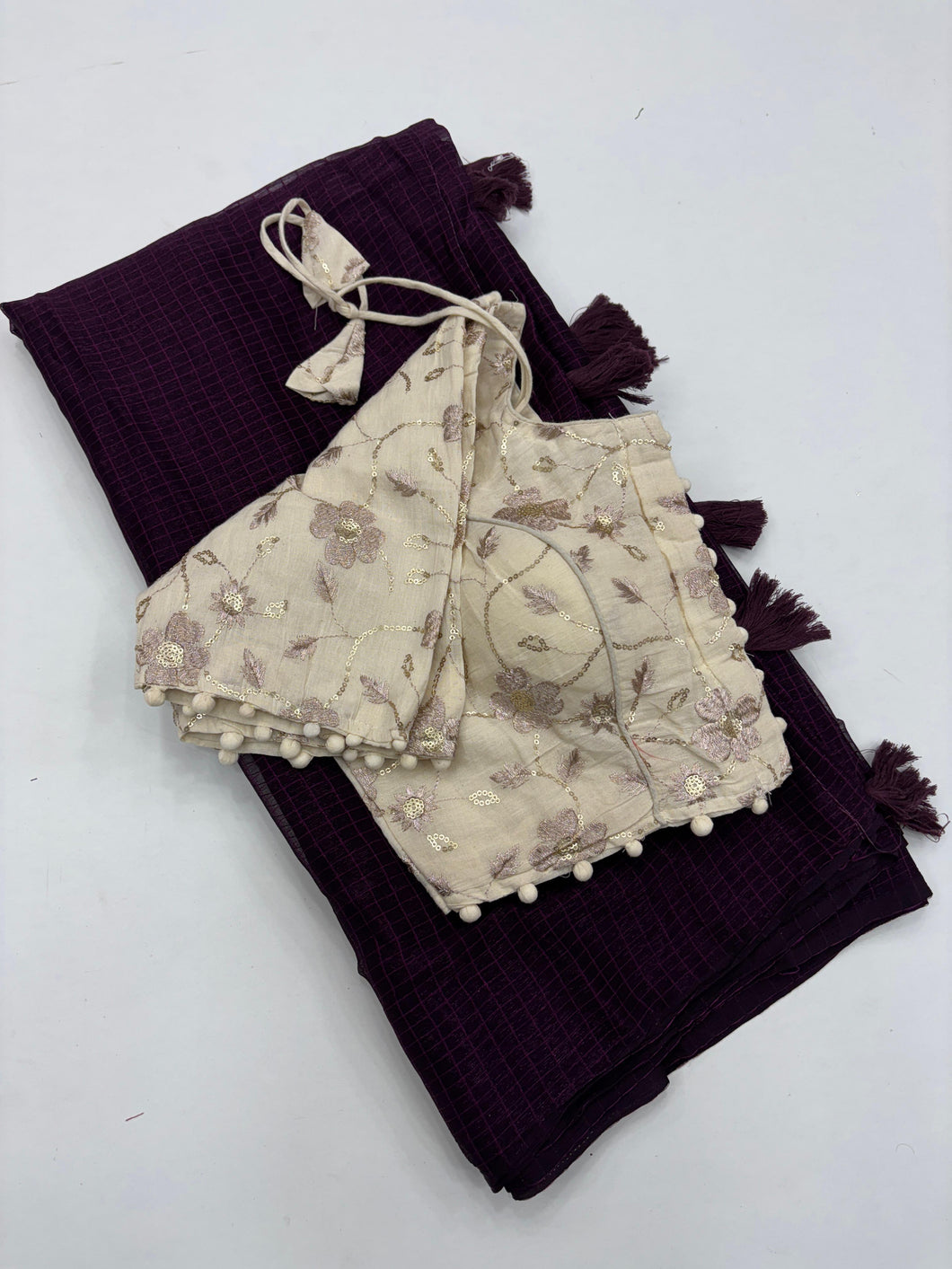 Breathtaking Wine Color Shimmer Nora Weaving Chex Fabric With Tassels Work Saree With Stitched Blouse