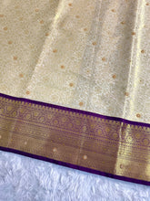 Load image into Gallery viewer, Charming Wedding Wear Light Cream Colour Banarasi Tissue Silk Handstone Work Stunning Pallu n Jacquard Border Saree

