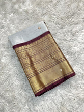 Load image into Gallery viewer, Luxuriant Wedding Wear Silver Colour Banarasi Tissue Silk Handstone Work Stunning Pallu n Jacquard Border Saree
