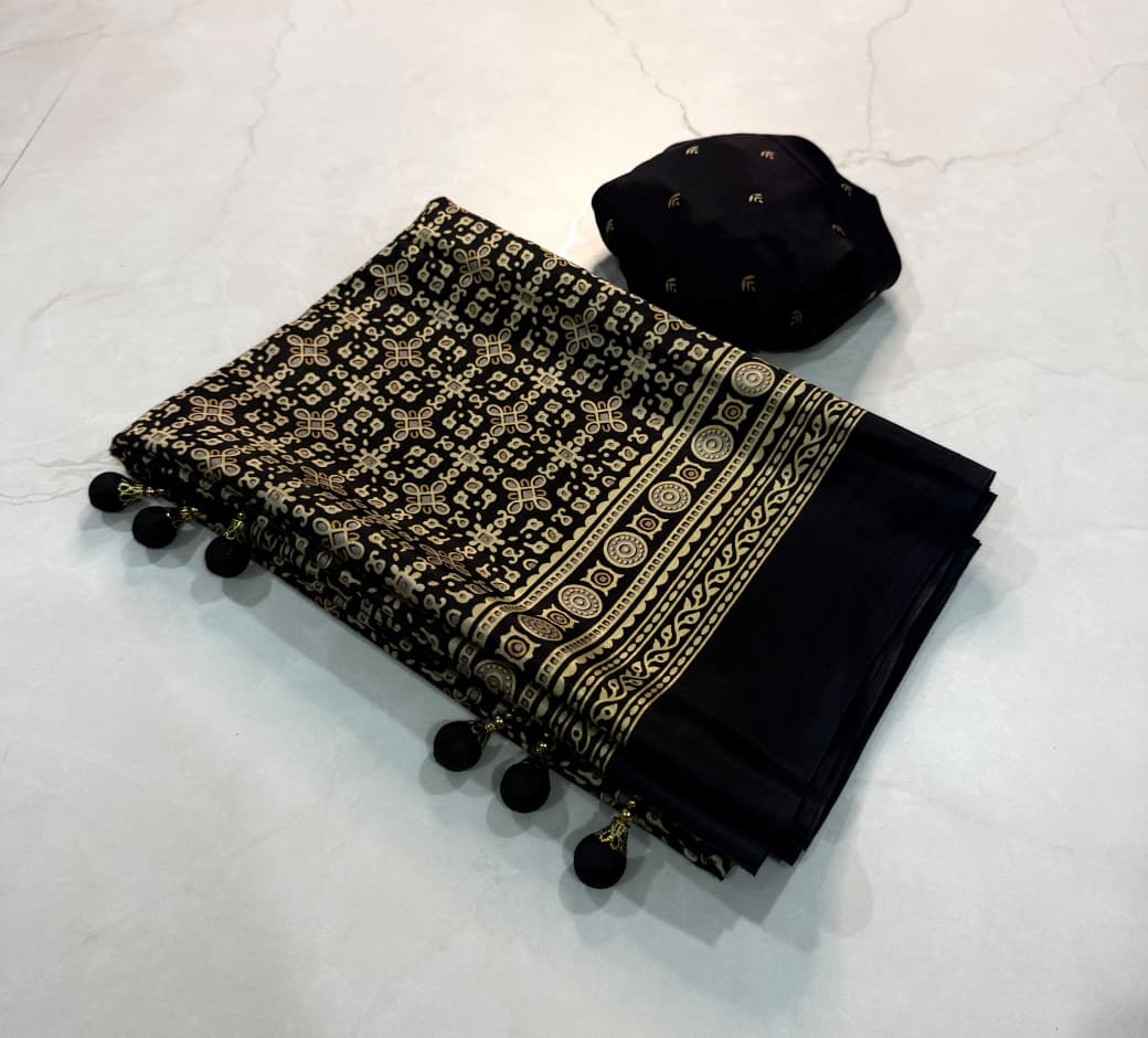 Dazzling Party Wear Crape Silk Ajrak Printed Tussel Work Fancy Saree With Blissful Blouse Piece