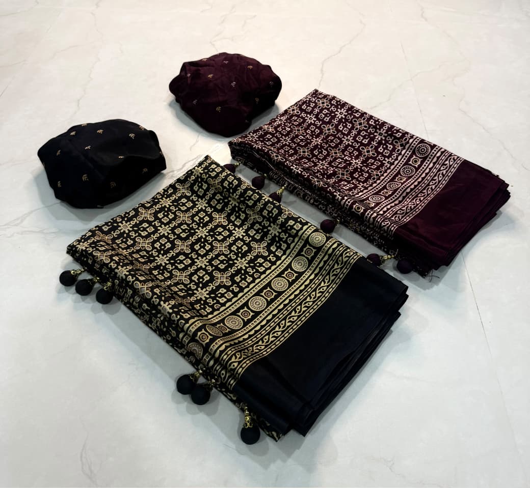 Dazzling Party Wear Crape Silk Ajrak Printed Tussel Work Fancy Saree With Blissful Blouse Piece