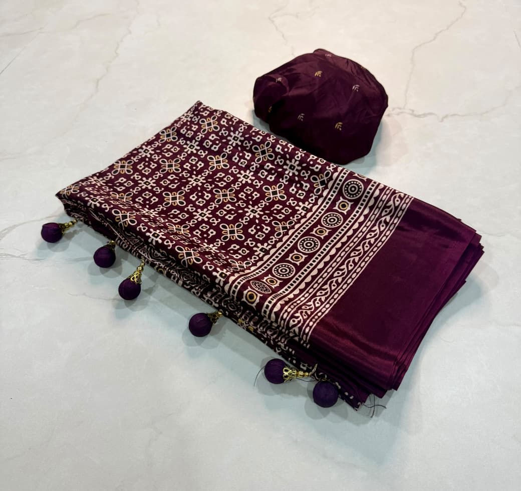 Dazzling Party Wear Crape Silk Ajrak Printed Tussel Work Fancy Saree With Blissful Blouse Piece