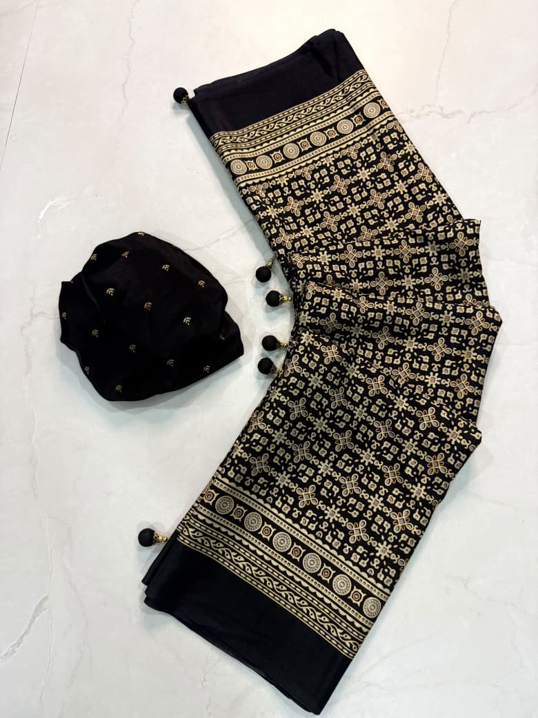 Dazzling Party Wear Crape Silk Ajrak Printed Tussel Work Fancy Saree With Blissful Blouse Piece