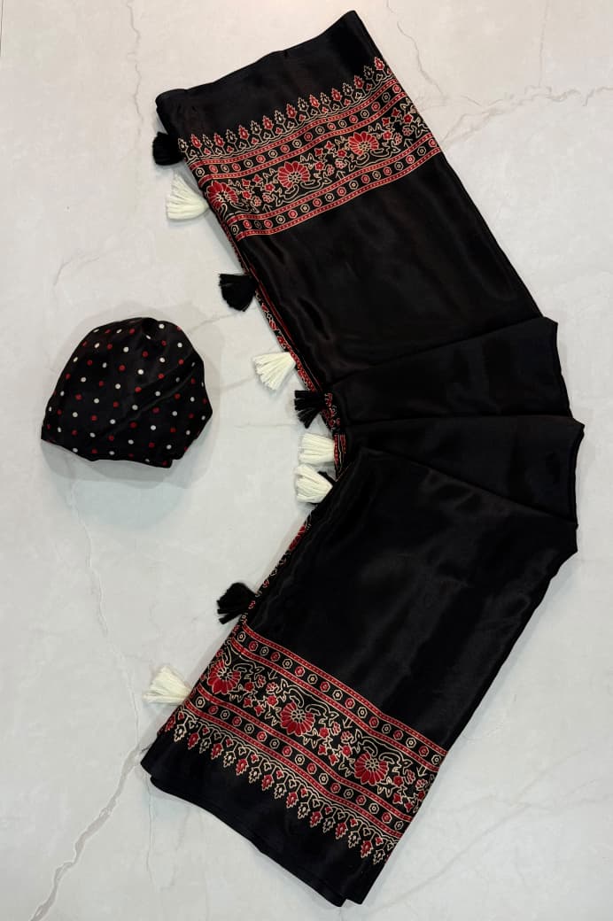Dazzling Party Wear Silk Ajrak Printed Tussels Work Designer Saree With Blouse Piece