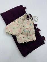 Load image into Gallery viewer, Breathtaking Wine Color Shimmer Nora Weaving Chex Fabric With Tassels Work Saree With Stitched Blouse
