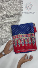 Load and play video in Gallery viewer, Gorgeous Party wear Pure Satin Silk Ajrak Printed Rich Pallu n Tussles Work Fancy Designer Saree
