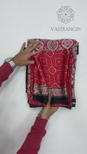 Load and play video in Gallery viewer, New Festive Wear Red n Black Color Pure Satin Silk Ajrak Printed Rich Pallu n Tussles Work Fancy Designer Saree
