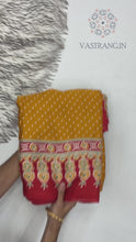 Load and play video in Gallery viewer, Gorgeous Party wear Pure Satin Silk Ajrak Printed Rich Pallu n Tussles Work Fancy Designer Saree

