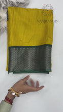 Load and play video in Gallery viewer, Surreptitious Yellow Color Pure Dola Silk Jacquard Weaving With Tassles Work Fancy Designer Saree With Classic Blouse Piece
