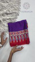 Load and play video in Gallery viewer, Gorgeous Party wear Pure Satin Silk Ajrak Printed Rich Pallu n Tussles Work Fancy Designer Saree
