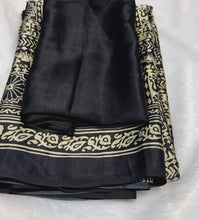 Load and play video in Gallery viewer, New Function Wear Black Color Pure Satin Silk Ajrak Printed Rich Pallu n Tussles Work Fancy Designer Saree
