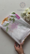 Load and play video in Gallery viewer, Florescences White Color Chiffon Floral Handbrush Print With Foil n Moti Lace Work Fancy Designer Saree
