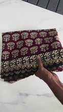 Load and play video in Gallery viewer, Glorious Black n Maroon Color Mul Cotton Print n Lace Work With Rich n Ikkat Pallu Designer Saree With Stunner Blouse Piece
