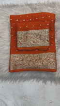 Load and play video in Gallery viewer, New Festive Wear Orange Color Viscose Georgette Jacquard Zari Weaving Work Fancy Designer Saree
