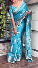 Load and play video in Gallery viewer, Classic Party Wear Muslin Cotton Zari Jacquard Border With Sequence Weaving Pearl lace in Saree Design
